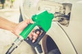 Hand refilling worker fuel the car at the refuel station Royalty Free Stock Photo