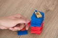 Hand remove the building block with top code lock Royalty Free Stock Photo