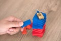 Hand remove the building block with top code lock Royalty Free Stock Photo