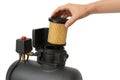 hand removing filter from air compressor Royalty Free Stock Photo