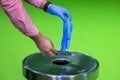 Hand removing rubber gloves in chroma concept sterility purity 