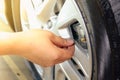 Hand removing a tire black. Royalty Free Stock Photo