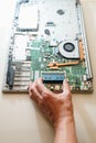 Hand of repairman holding a ram sodimm memory module, laptop upgrade Royalty Free Stock Photo