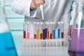 Hand of a researcher pipetting samples in tubes test Royalty Free Stock Photo