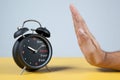 Hand resisting a clock Royalty Free Stock Photo