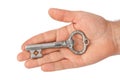 Hand with retro silver key Royalty Free Stock Photo