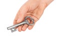 Hand with retro silver key Royalty Free Stock Photo
