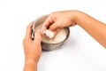 Hand rinses rise with water in a bowl in isolated white.