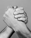 Hand rivalry vs challenge strength comparison. Two men arm wrestling. Arms wrestling. Closep up. Friendly handshake Royalty Free Stock Photo
