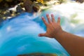 Hand with a river as background Royalty Free Stock Photo