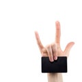 Hand with rock and roll sign holding blank for card, Bank card, isolated on white background, copy space Royalty Free Stock Photo