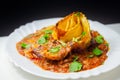 Hand rolled four cheese ravioli pasta in minced beef with Chianti red wine, garlic and herb ragu, and a bechamel sauce topped with Royalty Free Stock Photo