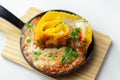 Hand rolled four cheese ravioli pasta in minced beef with Chianti red wine, garlic and herb ragu, and a bechamel sauce topped with Royalty Free Stock Photo