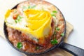 Hand rolled four cheese ravioli pasta in minced beef with Chianti red wine, garlic and herb ragu, and a bechamel sauce topped with Royalty Free Stock Photo