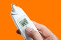 Medical electronic thermometer with high body temperature indicators,COVID-19,on a white background Royalty Free Stock Photo