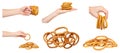 Hand with round dryed bagels, fast food snacks, set and collection