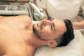 Dark haired man enjoying oxygen meso therapy