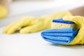 Hand in a rubber yellow glove holding sponge. Royalty Free Stock Photo