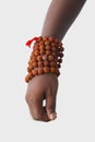 Hand with Rudraksha beads for chanting.