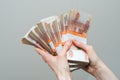 Hand with russian roubles bills on white background Royalty Free Stock Photo