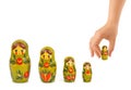 Hand and russian toy matrioska Royalty Free Stock Photo