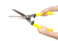 Hand and rusty garden shears