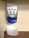 Hand sanitizer wall mounted dispenser with liquid sanitizer at a hospital