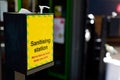 A hand sanitizing station outside of a shop to sanitize hands before entering during the global pandemic