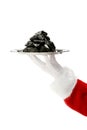 Hand of Santa Clause with tray of coal