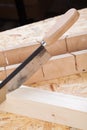 Hand saw cutting through a beam of wood Royalty Free Stock Photo