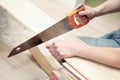 Hand saw cutting a board Royalty Free Stock Photo