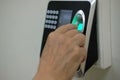 hand scanning finger print on access control machine. hour work