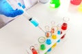 Science concept : Experimental liquid chemicals in laboratory test tubes closeup Royalty Free Stock Photo