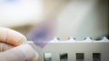 Hand scientist holding blood smear CBC