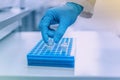 Hand of scientist holding dna test tube, research of biomaterial in the laboratory, Eco and genetic engineering Royalty Free Stock Photo