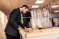 Hand scissor fabric. Cutting fabric closeup. Tailor at work