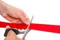 Hand with scissors cutting red ribbon - opening ceremony Royalty Free Stock Photo