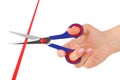 Hand with scissors and ribbon Royalty Free Stock Photo