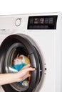 The hand select settings for laundry on modern digital display. Close-up view of automatic washing machine with touch screen on Royalty Free Stock Photo