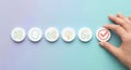 Hand selecting a checkmark icon among business and innovation related symbols Royalty Free Stock Photo
