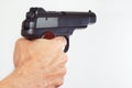 Hand with semi-automatic handgun closeup Royalty Free Stock Photo