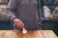 Hand of senior woman painting a wooden table Royalty Free Stock Photo