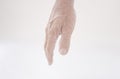 Hand of senior woman on white background. Isolated. Copy space Royalty Free Stock Photo