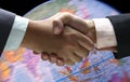 Hand shake background foreign currency Royalty Free Stock Photo