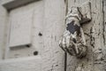 Hand shaped knob of a wooden door Royalty Free Stock Photo