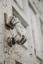 Hand shaped knob of a wooden door Royalty Free Stock Photo