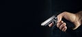 Hand shooting gun on black background killer concept Royalty Free Stock Photo