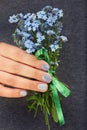 Hand with short manicured nails colored with gray nail polish Royalty Free Stock Photo