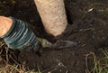 Hand with shovel working in the garden Royalty Free Stock Photo