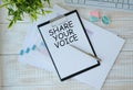 Hand show Share Your Voice text written on small whiteboard isolated on white background Royalty Free Stock Photo